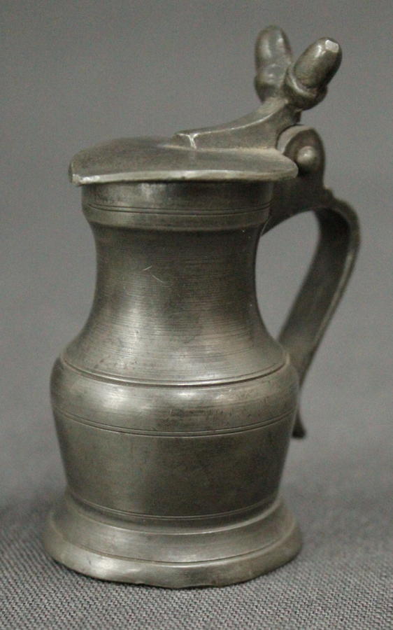 A small 19th Century pewter lidded measure