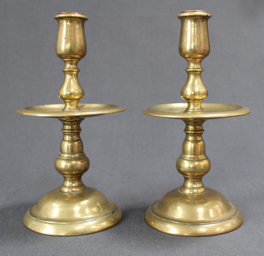 A pair of Heemskerk brass candlesticks