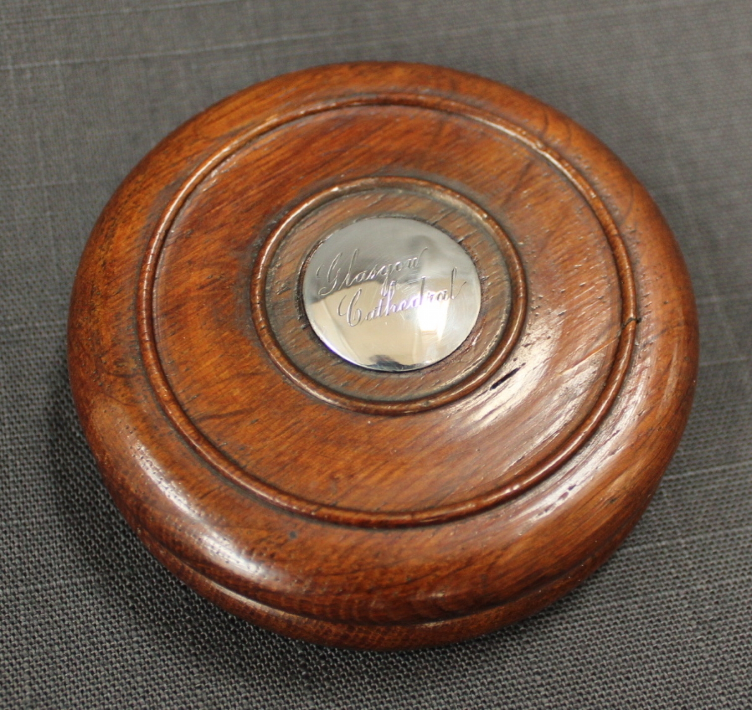 An oak 'double disc' circular snuff box