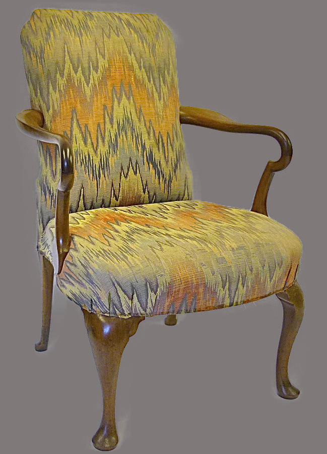A walnut framed open elbow chair