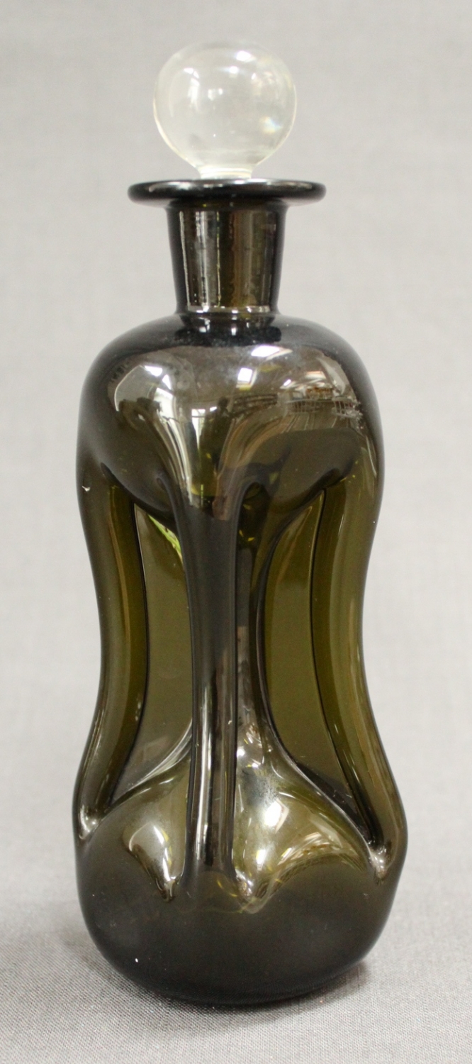 A green glass waisted liqueur decanter